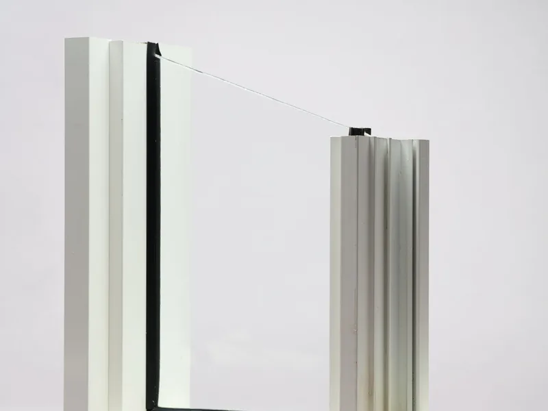 Premium aluminum sliding window section showcasing weatherstripping and dual glazing.