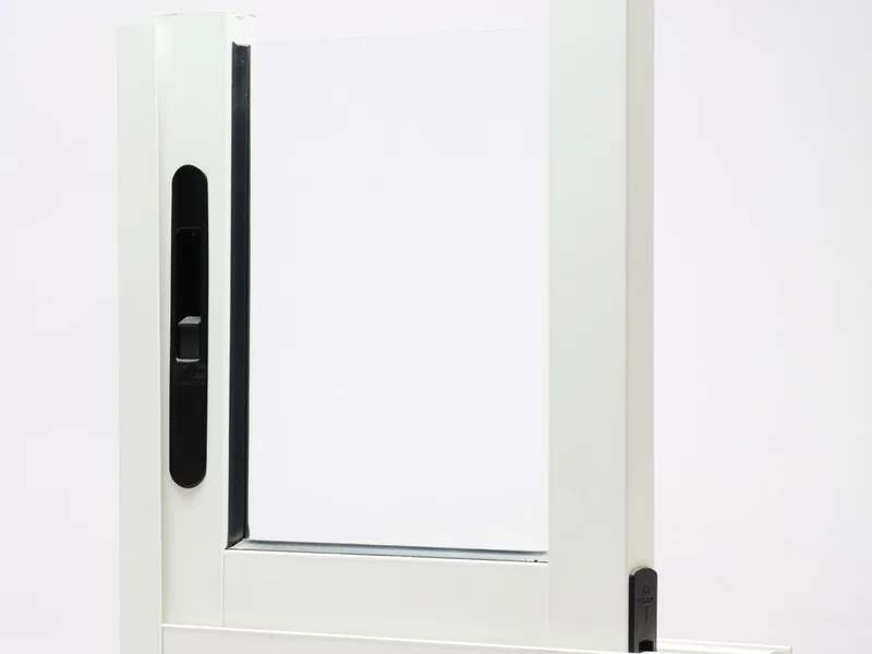 Slim-line architectural aluminum door profile and hinge assembly.